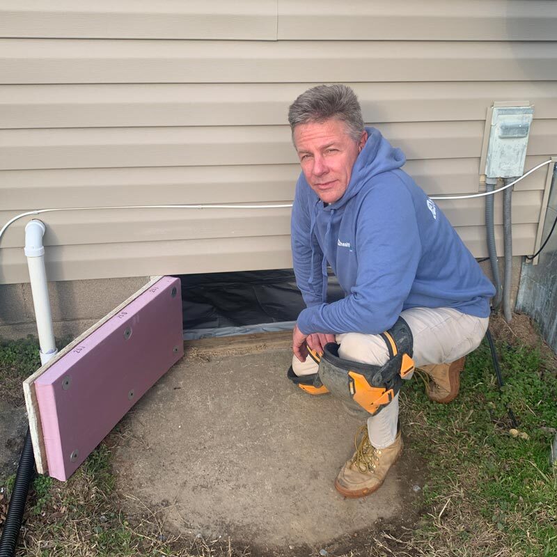 Preparing to inspect a crawlspace.