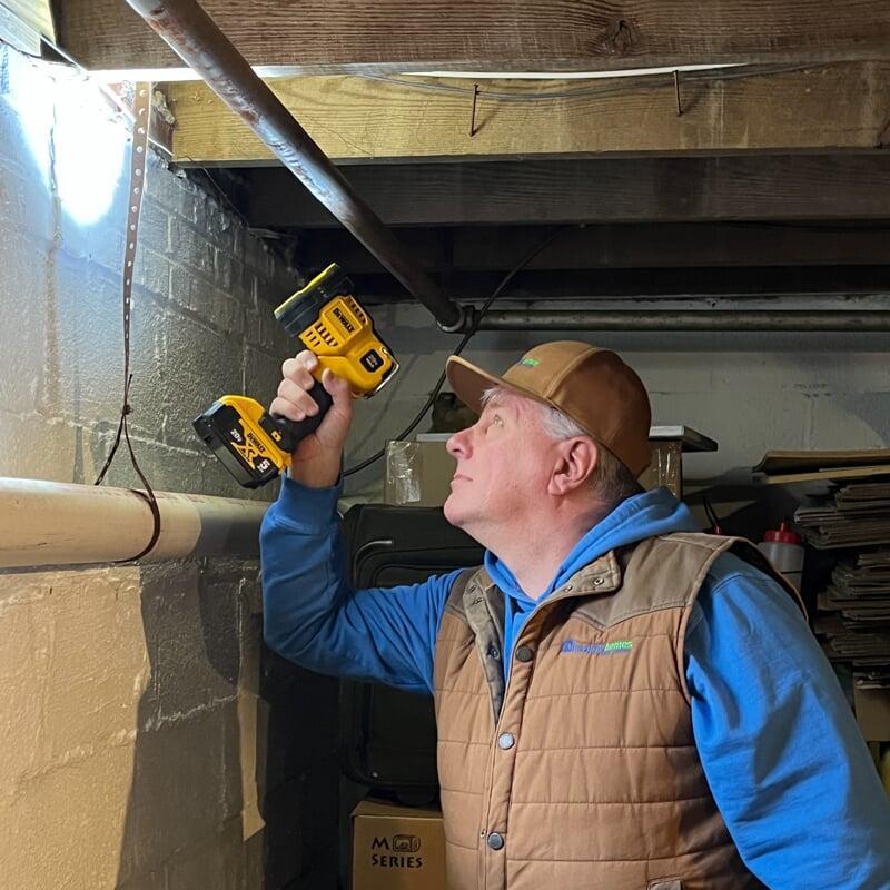 Technician performing a wood destroying insect or termite inspection.