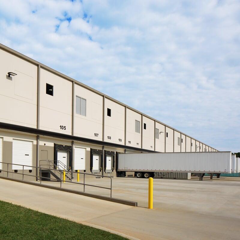 Attention is focused on pest entry points like overhead doors and dock levelers.